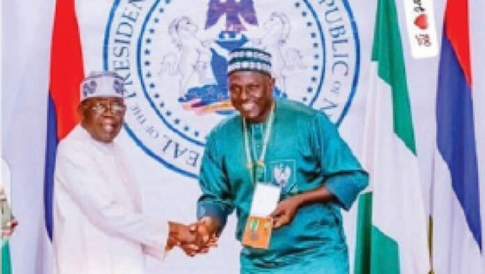 A good job deserves Presidential handshake – Super Eagles Team CoordinatorPatrick Pascal (MON) in a handshake with President Tinubu recently.
