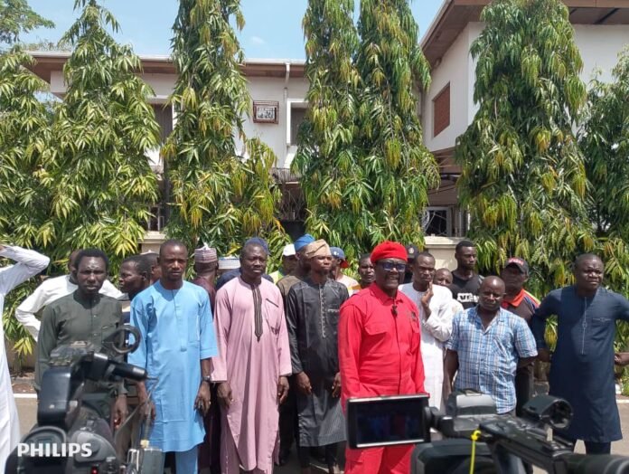 Murtala Garba (in red) at the briefing